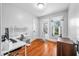 This is an office with white walls and brown, hardwood floors and a set of double doors at 3515 Guilford Ave, Indianapolis, IN 46205