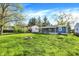 Large, grassy backyard features a cozy fire pit and plenty of space for activities at 3538 Cecil Ave, Indianapolis, IN 46226
