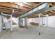 Unfinished basement with visible utilities and cement floors, offering potential for customization at 3538 Cecil Ave, Indianapolis, IN 46226