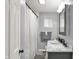 Clean bathroom featuring a new vanity, framed mirror, new faucet and shower with curtain at 3538 Cecil Ave, Indianapolis, IN 46226