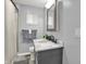 Clean bathroom featuring a new vanity, framed mirror, new faucet and shower with curtain at 3538 Cecil Ave, Indianapolis, IN 46226