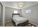 Bright bedroom with hardwood floors and ample light at 3538 Cecil Ave, Indianapolis, IN 46226