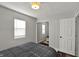 Bright bedroom with hardwood floors and a mirrored closet at 3538 Cecil Ave, Indianapolis, IN 46226