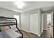 Bedroom featuring bunk beds, hardwood floors, and a closet at 3538 Cecil Ave, Indianapolis, IN 46226