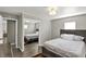 Bright bedroom with hardwood floors, natural light, and a closet at 3538 Cecil Ave, Indianapolis, IN 46226