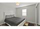 Bright bedroom with hardwood floors and a closet at 3538 Cecil Ave, Indianapolis, IN 46226