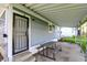 Covered patio with seating offers an outdoor relaxing and dining area at 3538 Cecil Ave, Indianapolis, IN 46226