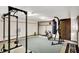 Home gym featuring workout equipment, including weights, punching bag, and weight rack at 3875 Arrowhead Ct, Greenfield, IN 46140