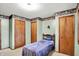 Cozy bedroom with ample closet space and soft carpeting at 3875 Arrowhead Ct, Greenfield, IN 46140