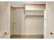 Bright closet with wooden shelves, hanging rods, neutral walls, and louvered doors at 3875 Arrowhead Ct, Greenfield, IN 46140