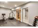 Home gym featuring rubber flooring, treadmill, weights, rowing machine, and a full sized sauna at 3997 Spylaw Rd, Bargersville, IN 46106