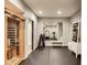Home gym featuring rubber flooring, treadmill, weights, rowing machine, and a full sized sauna at 3997 Spylaw Rd, Bargersville, IN 46106