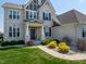 Beautiful two-story home featuring a manicured lawn and a welcoming front entrance at 3997 Spylaw Rd, Bargersville, IN 46106
