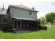 Back patio with table, grill and shade structure, offers perfect place for outdoor entertaining at 4166 Cobblestone Way, Greenwood, IN 46143
