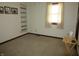 Bright bedroom with a window, built-in shelving, and neutral carpet at 4166 Cobblestone Way, Greenwood, IN 46143