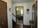 Inviting entryway featuring hardwood floors, a coat rack, and an entry to the dining room at 4166 Cobblestone Way, Greenwood, IN 46143