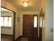 Bright foyer showcasing a wooden front door with sidelight and hardwood floors at 4166 Cobblestone Way, Greenwood, IN 46143