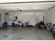 Garage interior with storage and lawn care equipment at 4166 Cobblestone Way, Greenwood, IN 46143