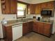 Kitchen with wood cabinets, stainless steel sink, and modern appliances at 4166 Cobblestone Way, Greenwood, IN 46143