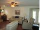 Comfortable living room with hardwood floors, fireplace, and access to the backyard at 4166 Cobblestone Way, Greenwood, IN 46143