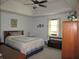 Spacious main bedroom with large bed, ceiling fan, and a window providing plenty of natural light at 4166 Cobblestone Way, Greenwood, IN 46143
