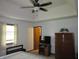 Spacious main bedroom featuring a ceiling fan, large window, and tray ceiling at 4166 Cobblestone Way, Greenwood, IN 46143