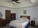 Spacious main bedroom with large bed, ceiling fan, and a window providing plenty of natural light at 4166 Cobblestone Way, Greenwood, IN 46143