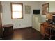 Office space with built in desk and shelving, TV, and a window providing plenty of natural light at 4166 Cobblestone Way, Greenwood, IN 46143