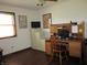 Office space with built in desk and shelving, TV, and a window providing plenty of natural light at 4166 Cobblestone Way, Greenwood, IN 46143
