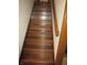 A wooden staircase with a handrail leads to the upper level at 4166 Cobblestone Way, Greenwood, IN 46143