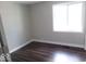 Cozy bedroom with hardwood floors and a bright window at 418 N 14Th St, Elwood, IN 46036