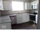 Modern kitchen featuring stainless steel appliances, white cabinets, and granite countertops at 418 N 14Th St, Elwood, IN 46036