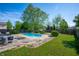 Lush backyard with a clear blue pool, perfect for outdoor enjoyment at 419 Old Glory Dr, Greenfield, IN 46140