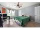 Cozy bedroom with natural light, a ceiling fan, and neutral tones offering a relaxing ambiance at 419 Old Glory Dr, Greenfield, IN 46140