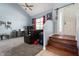Inviting living room with vaulted ceilings, carpeted floor, wood stairs, and plenty of natural light at 419 Old Glory Dr, Greenfield, IN 46140