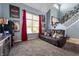 Inviting living room featuring plush carpeting, high ceilings, ample natural light, and neutral paint at 419 Old Glory Dr, Greenfield, IN 46140