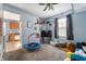 Vibrant play room with a ceiling fan, carpeted floor, a large window, and comfortable seating at 419 Old Glory Dr, Greenfield, IN 46140