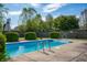 Inviting pool surrounded by concrete and landscaping, ideal for relaxation and recreation at 419 Old Glory Dr, Greenfield, IN 46140