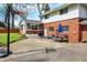 Spacious backyard featuring an outdoor seating area, a basketball hoop, and a lush lawn at 4260 Springwood Trl, Indianapolis, IN 46228