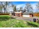 Expansive backyard with a two-car garage, lawn, and partial fencing at 4260 Springwood Trl, Indianapolis, IN 46228