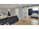 Basement with sofa, play area, stairs and an open doorway to the bedroom at 4260 Springwood Trl, Indianapolis, IN 46228