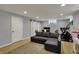 Finished basement with sliding door, sofa, workout equipment, desk and window at 4260 Springwood Trl, Indianapolis, IN 46228