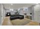 Spacious finished basement with sofa, workout equipment, desk and two windows at 4260 Springwood Trl, Indianapolis, IN 46228