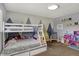 Bedroom with bunkbeds, mountain-themed walls, toys, and carpeting at 4260 Springwood Trl, Indianapolis, IN 46228