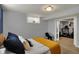 Comfortable bedroom featuring light gray walls, bright lighting, and an adjoined workout space at 4260 Springwood Trl, Indianapolis, IN 46228