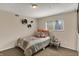 Comfortable bedroom with a cozy bed, carpet flooring, and a window at 4260 Springwood Trl, Indianapolis, IN 46228