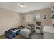 Cozy bedroom with a unique race car bed and a comfortable armchair near the window at 4260 Springwood Trl, Indianapolis, IN 46228