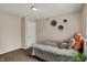 Cozy bedroom with a comfortable bed, textured ceiling, and neutral décor at 4260 Springwood Trl, Indianapolis, IN 46228