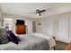 Bedroom featuring a plush bed, a ceiling fan, and closet with doors at 4260 Springwood Trl, Indianapolis, IN 46228