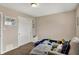 Bedroom featuring closet, soft furniture, neutral-toned walls, and a cozy rug at 4260 Springwood Trl, Indianapolis, IN 46228